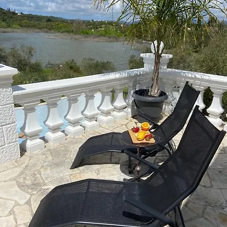 By The In Karoubatika Near Vila